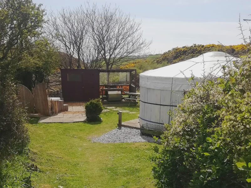 View of Yurt pitch and the valley leading down to Porth Dafarch beach