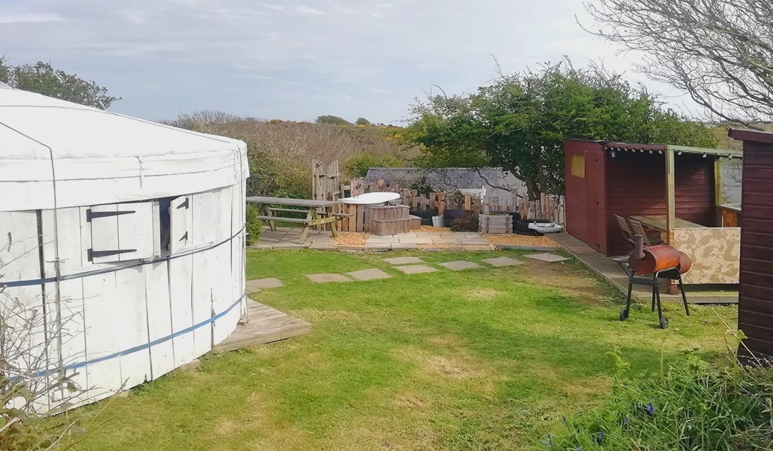 View of Seren Yurt pitch with hot tub