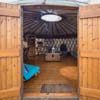 Looking inside of Llyn Yurt from double doors