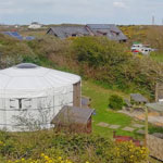 View of Seren Yurt pitch and the valley leading down to Porth Dafarch beach