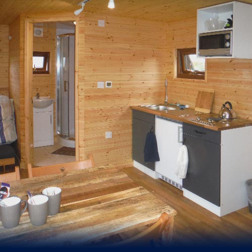 Shower, wash area and kitched inside the Eco Den