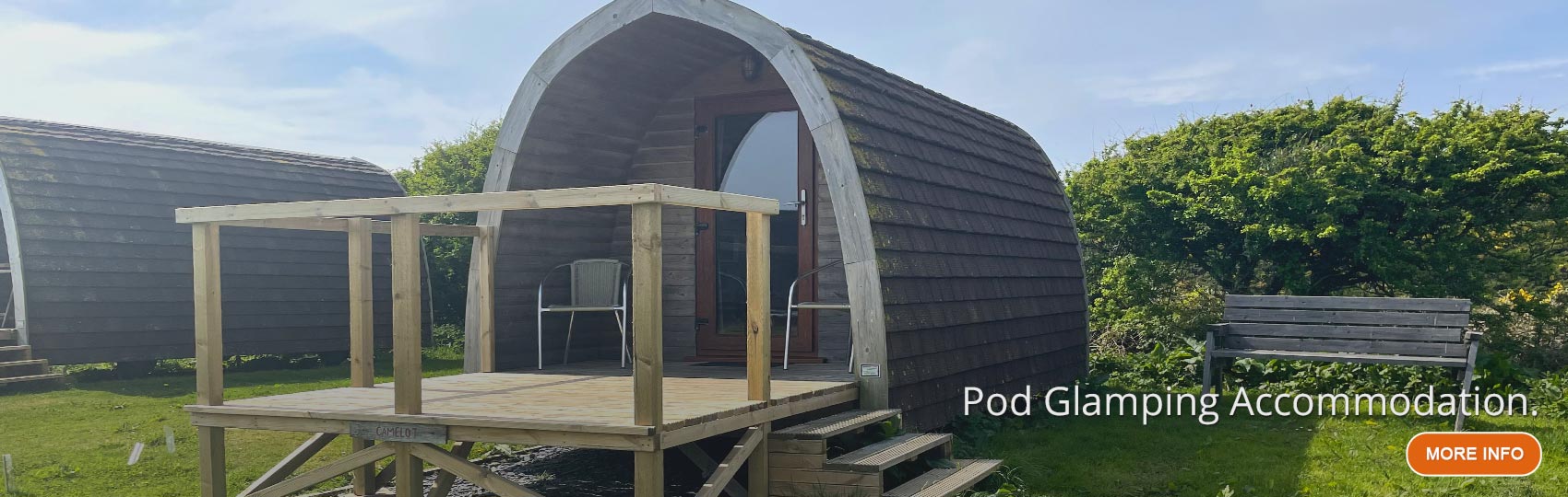 Lady relaxing in the porch of a glamping Pod on North Wales hill